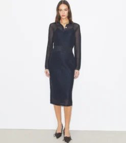 POLOKLEID IN METALLIC-OPTIK