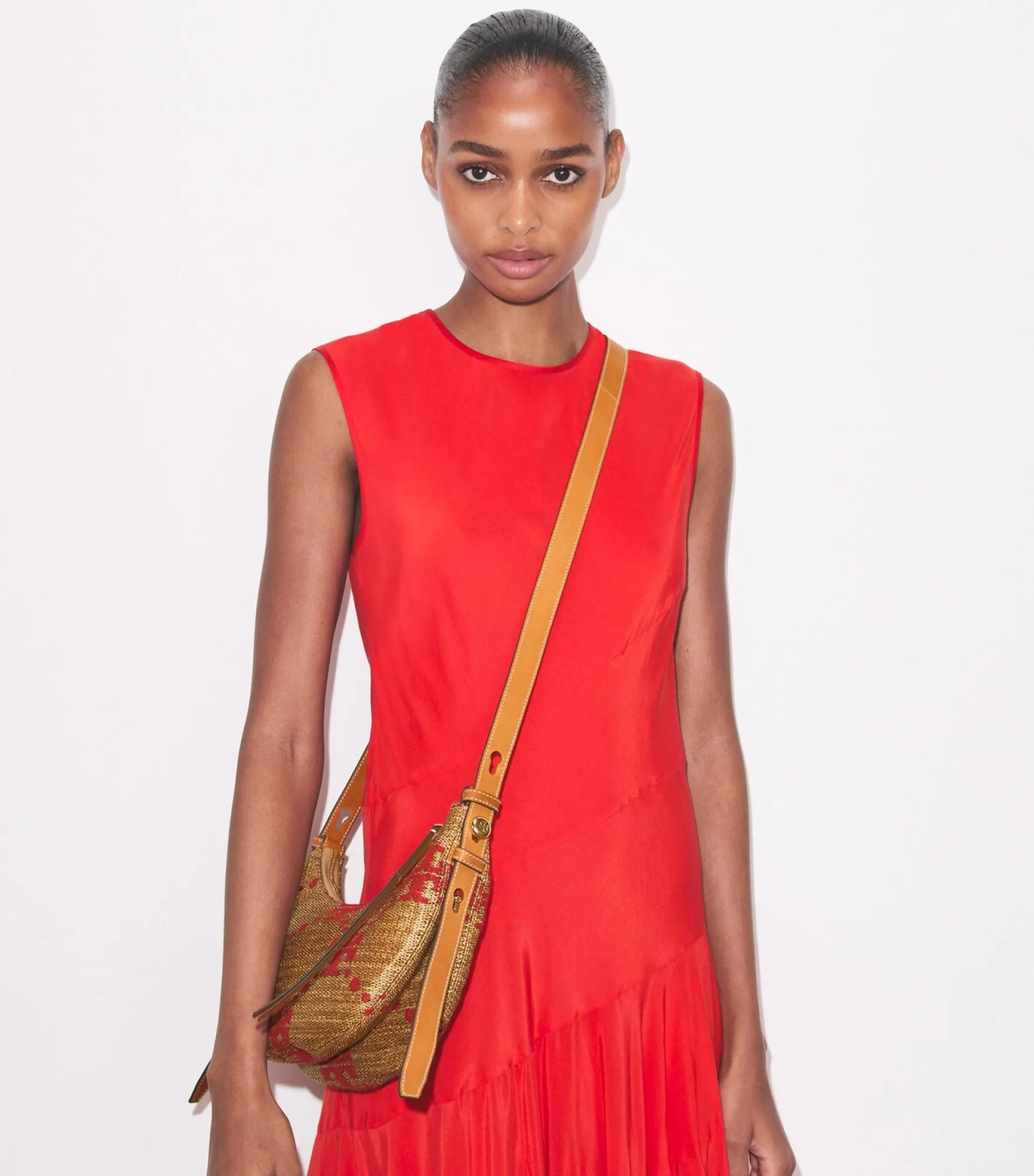 T MONOGRAM ROMY WOVEN HALF MOON BAG